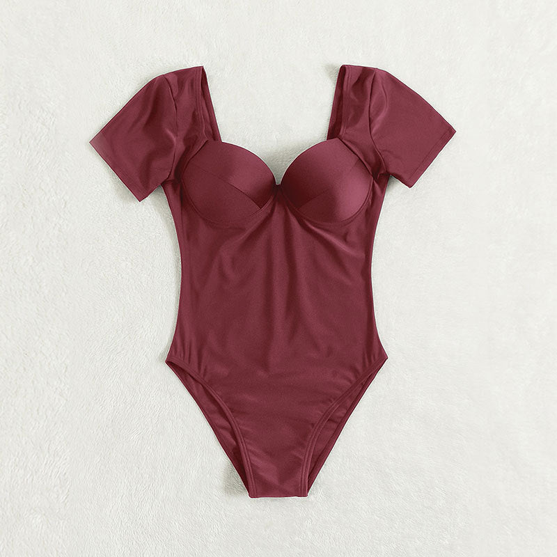 Damen Einteiler Badeanzug mit eleganten Trägern und sculpturalem V-Ausschnitt Echo Archiv