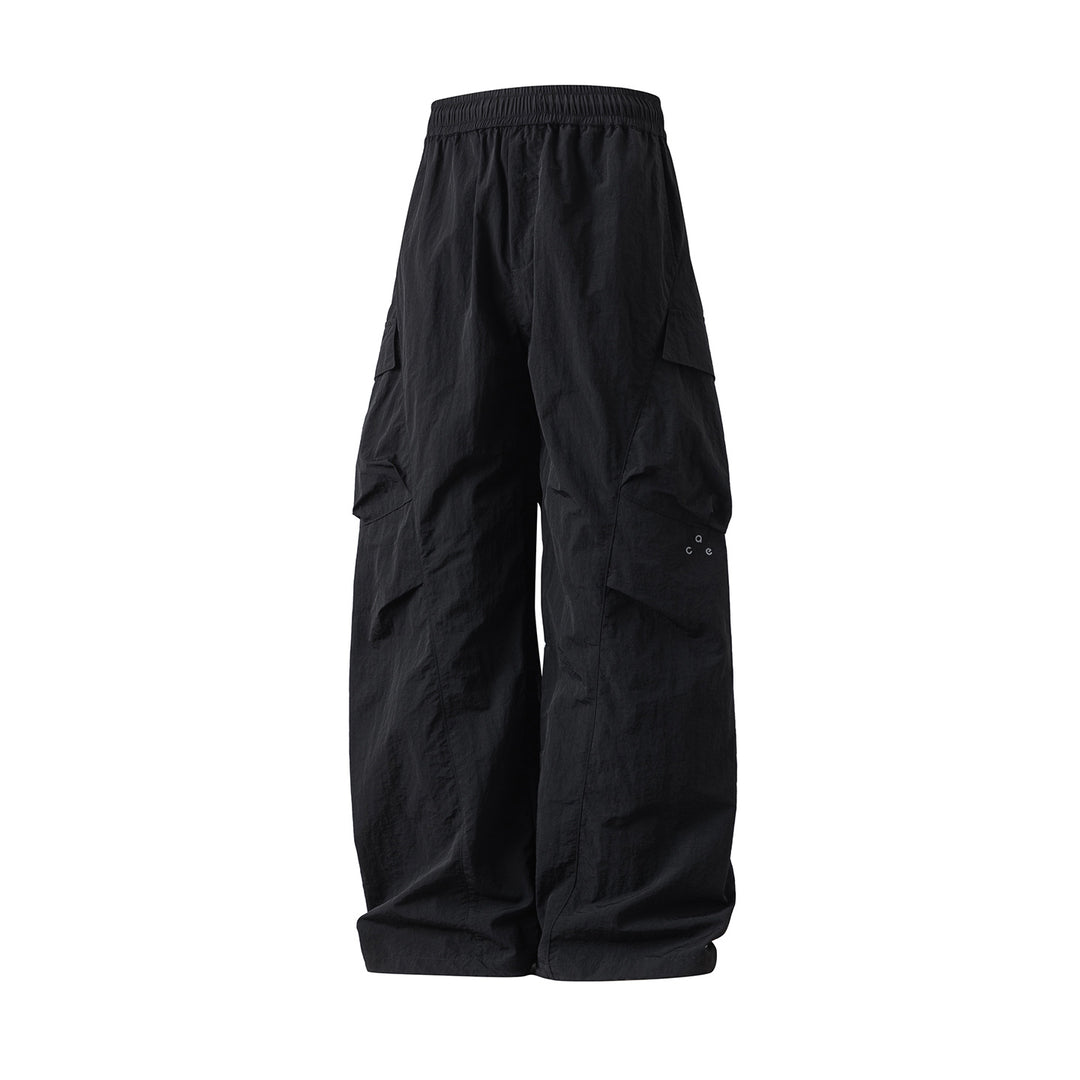 Unisex Extraweite Nylon‑Cargo‑Palazzohose mit elastischem Comfort‑Bund und asymmetrischen Klappentaschen Echo Archiv