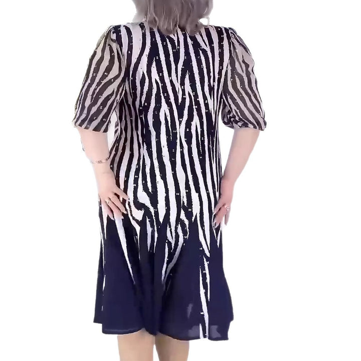 Damen nan tailliertes Midikleid mit grafischem Animalmuster, transparenten Puffärmeln und schwingendem Faltenrock Echo Archiv