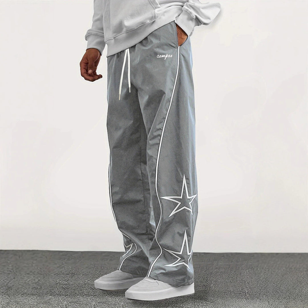 Herren Weite Trackpants mit Kontrastpaspel, Kordelzug und Sternapplikation Echo Archiv