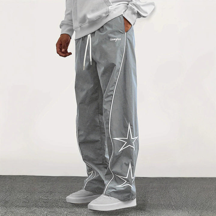 Herren Weite Trackpants mit Kontrastpaspel, Kordelzug und Sternapplikation Echo Archiv