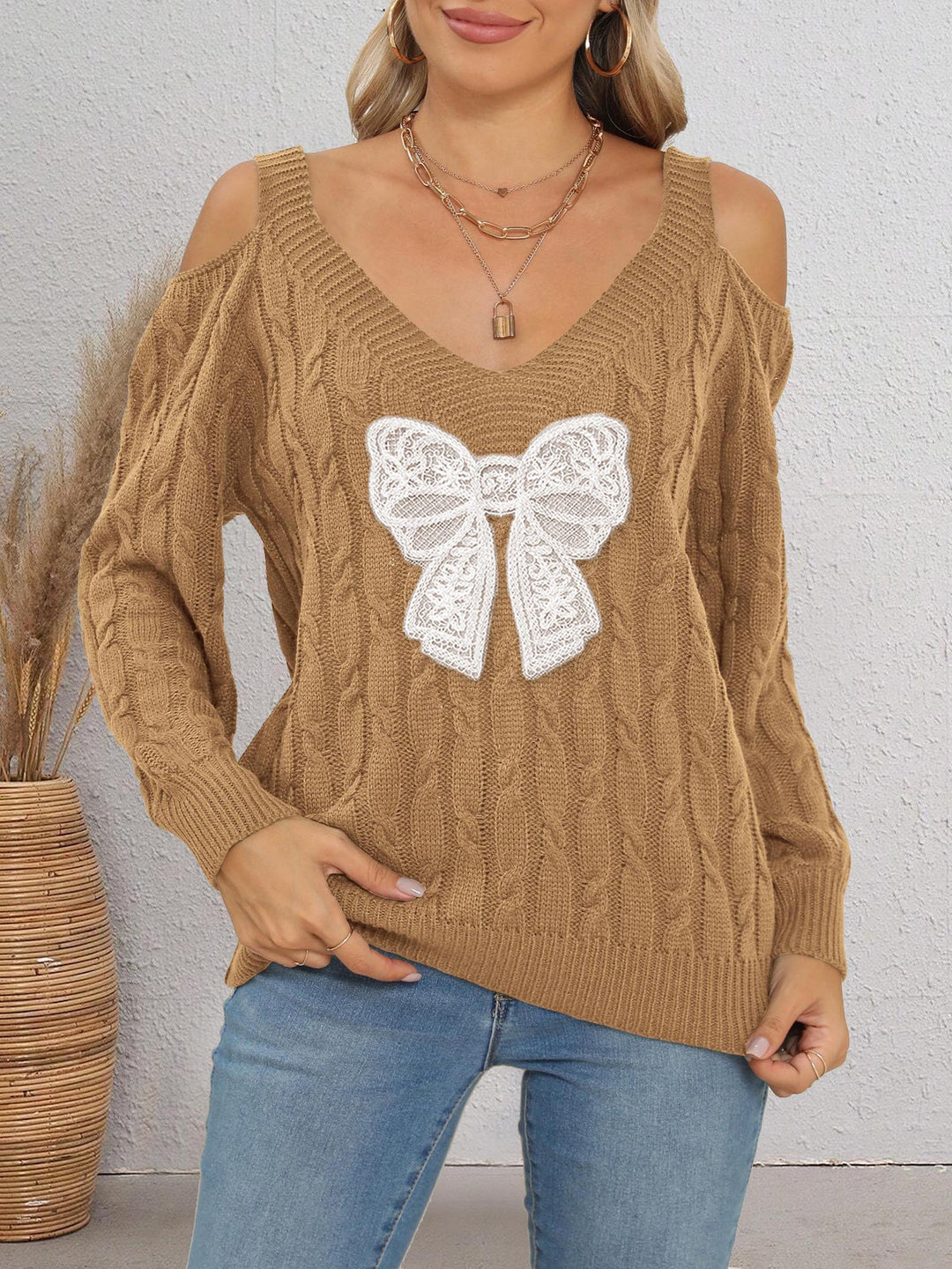 Damen modischer Pullover mit verspielt eingestricktem Schleifenmotiv Echo Archiv
