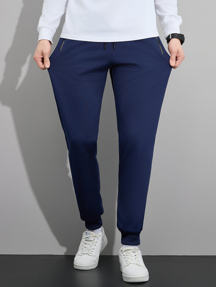 Herren Tapered Performance-Jogginghose mit elastischem Bund, Reißverschlusstaschen & gerippten Beinbündchen Echo Archiv