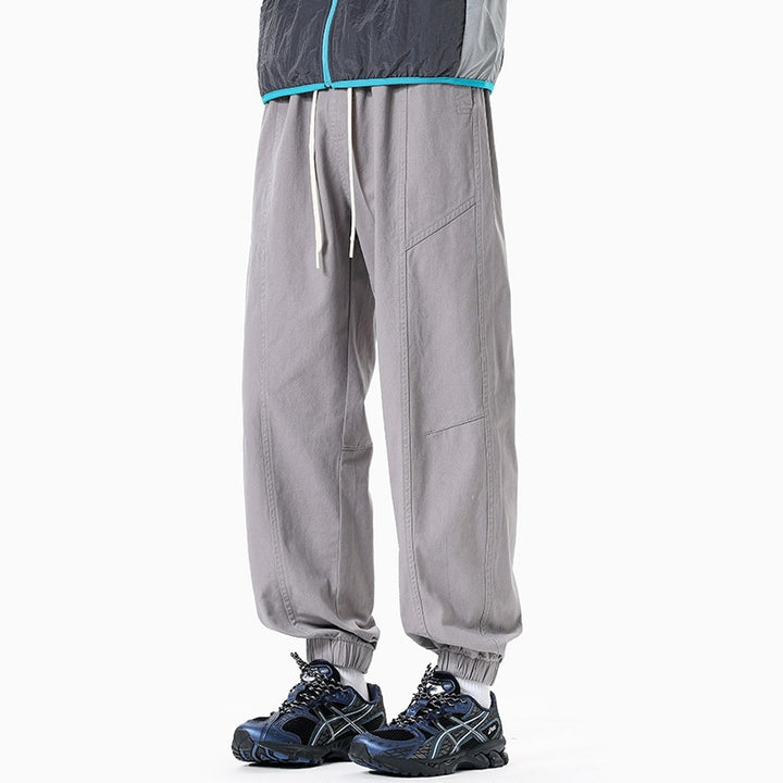 Herren Oversized Utility-Jogginghose aus robustem Baumwollmix mit Kordelbund, seitlichen Cargo‑Taschen & gerippten Bündchen Echoarchiv