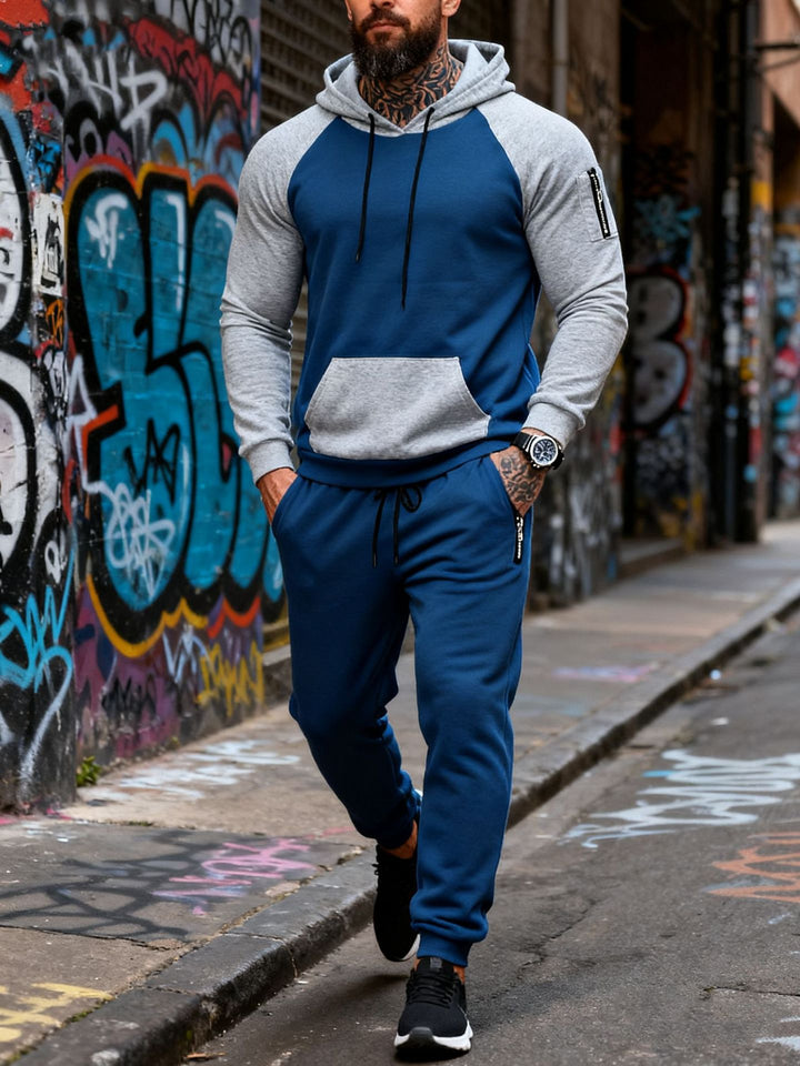 Herren nan zweiteiliges Kapuzen-Sweatset mit Raglanärmeln, Ärmel-Zip-Tasche und tapered Jogginghose Echo Archiv