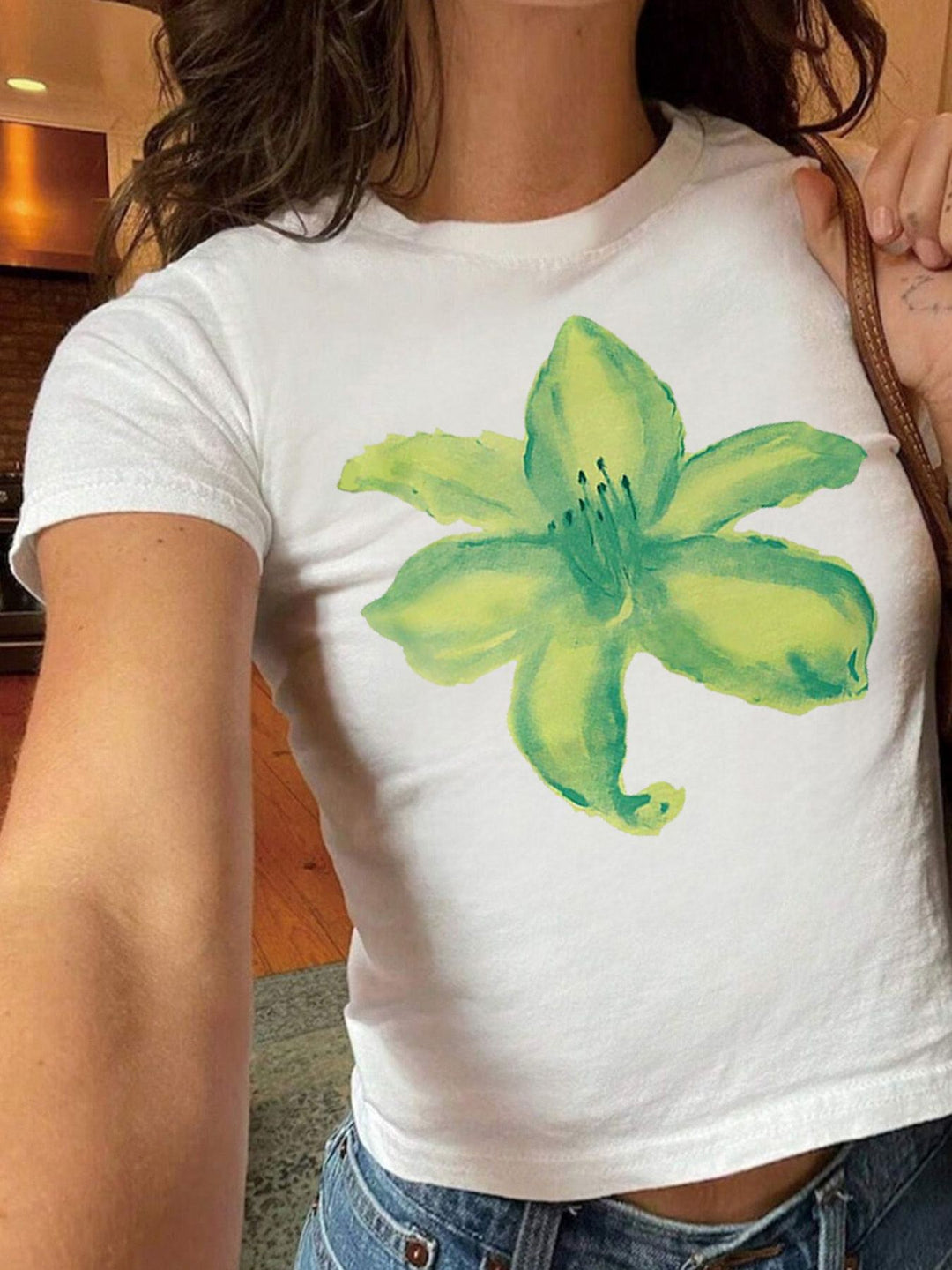 Damen T-Shirt mit funkelndem Discokugel-Motiv und zeitgemäßem Schleifendetail Echo Archiv