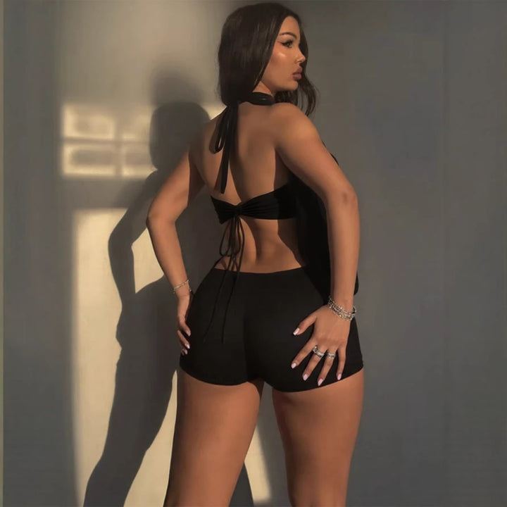 Damen Elegantes Jumpsuit mit tiefem V-Ausschnitt und dekorativem Ringdetail Echo Archiv