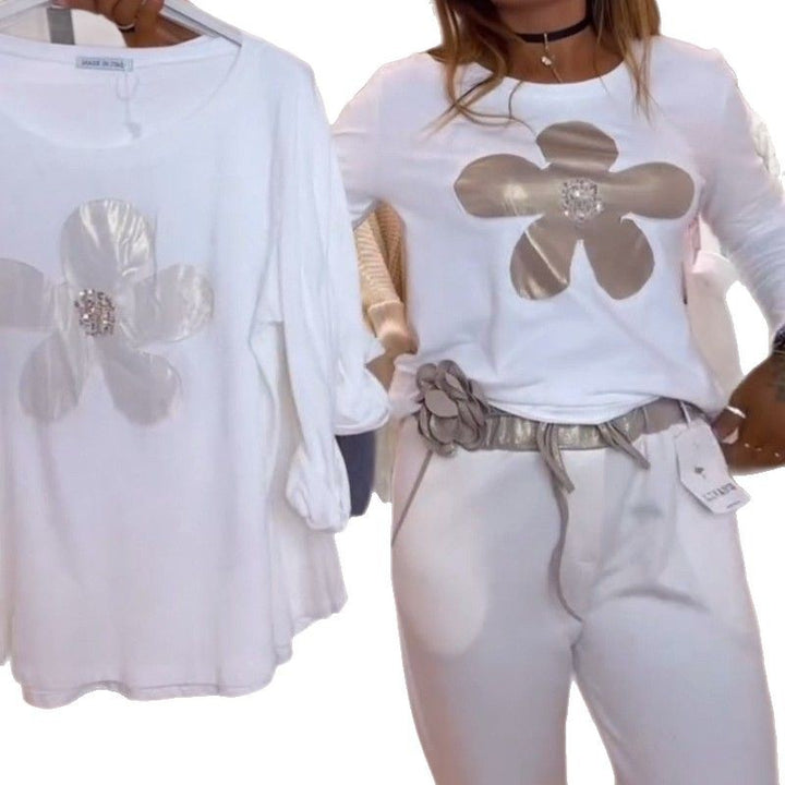 Damen nan locker geschnittenes Langarmshirt mit glänzender Blumenapplikation und Strassmitte Echo Archiv