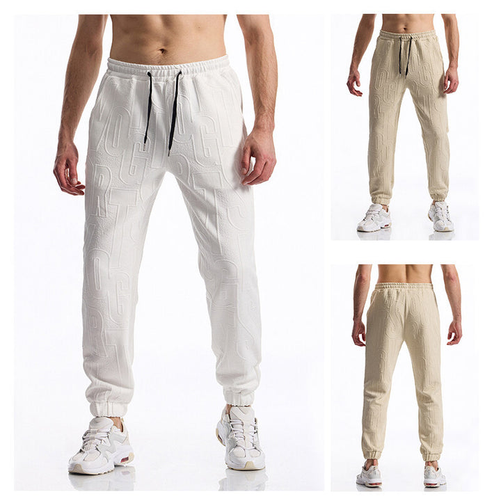 Herren Jogginghose mit elastischem Bund, Tunnelzug und geprägtem Allover‑Logo‑Relief Echo Archiv