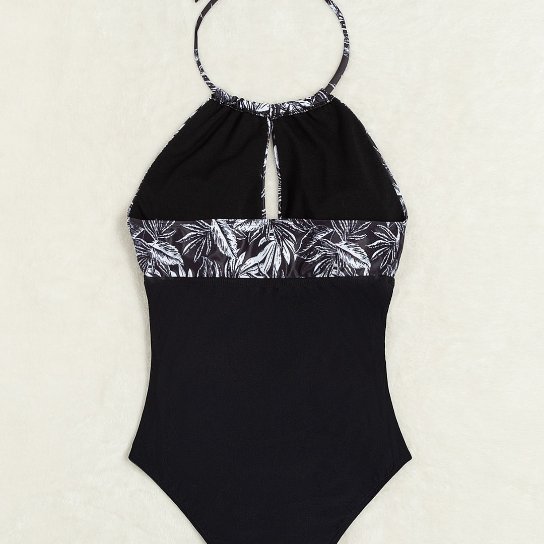 Damen Eleganter Badeanzug mit tiefem Ausschnitt und floralem Design Echo Archiv