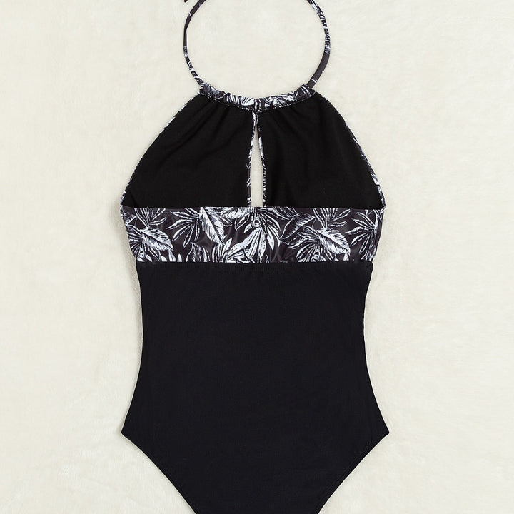 Damen Eleganter Badeanzug mit tiefem Ausschnitt und floralem Design Echo Archiv