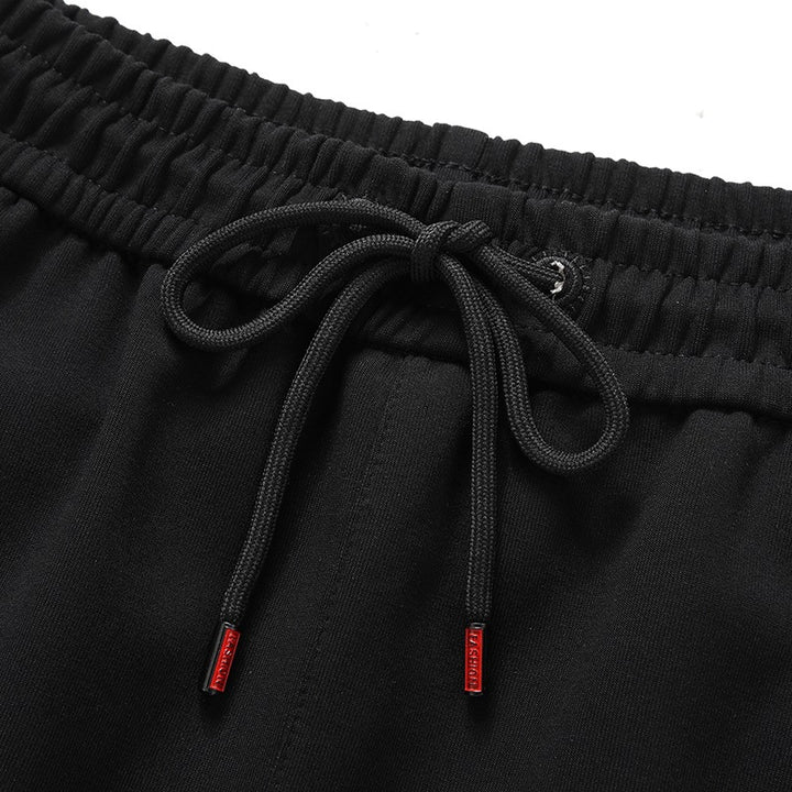 Herren Sportliche konisch zulaufende Jogginghose mit Elastbund, Kordelzug & Reißverschlusstaschen Echoarchiv
