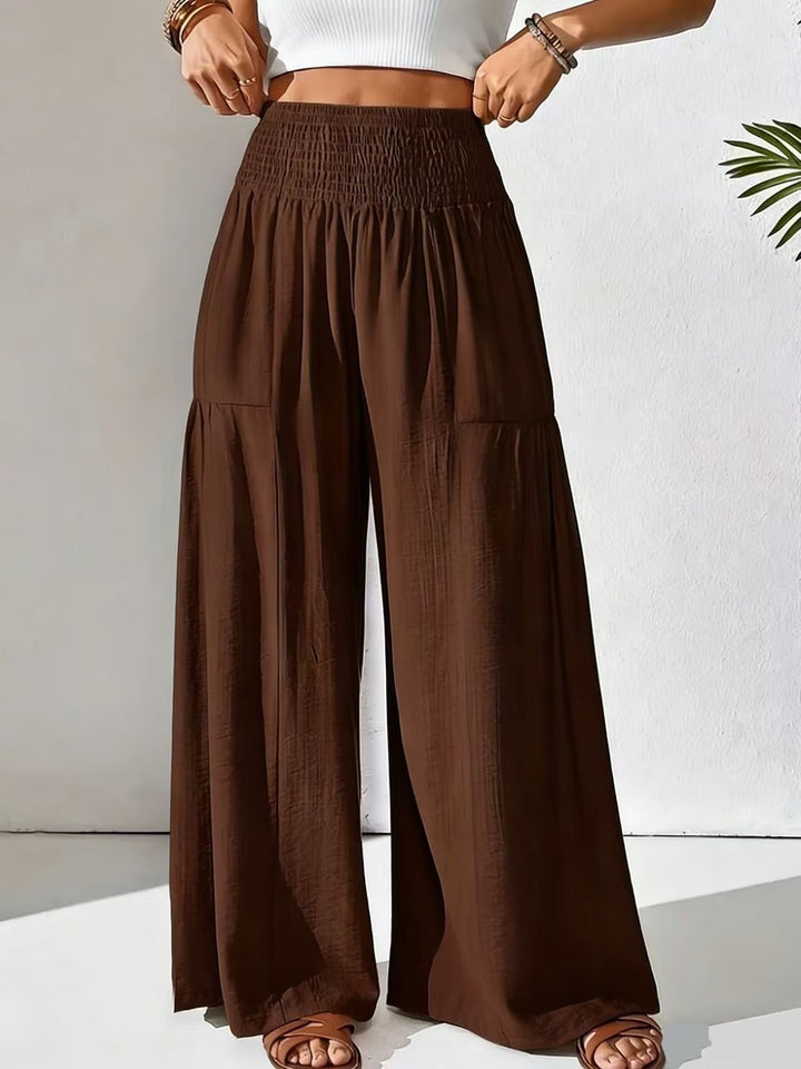 Damen weite Palazzo-Hose mit gerafftem Smock-Bund und Stufendetails – Avélisse