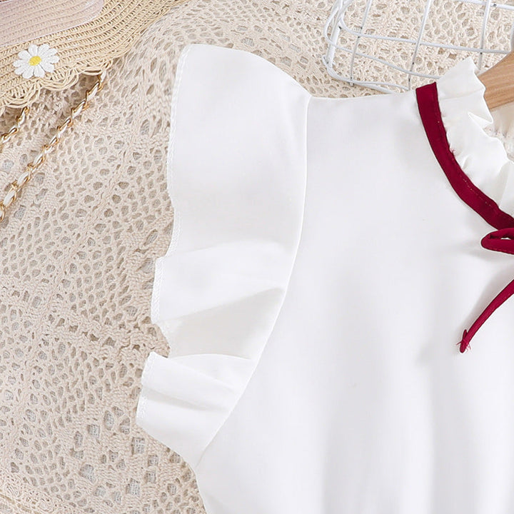 Mädchen Faltenrockkleid mit Puffärmeln und Taillenknoten Echoarchiv