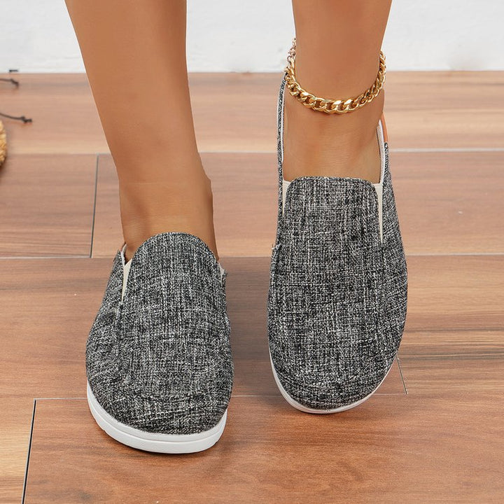 Damen  Slip-On Canvas‑Mules mit Kuhfleckenprint, gepolstertem Komfortfußbett und rutschfester Leichtsohle Echo Archiv