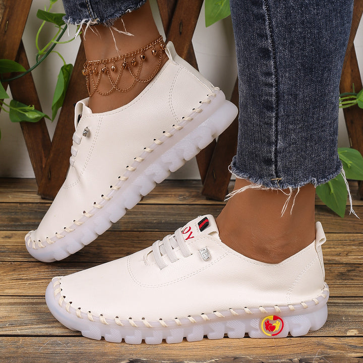 Damen Bequeme Lederoptik-Slipper mit flexibler Profilsohle und Mokassin-Naht – Lioré