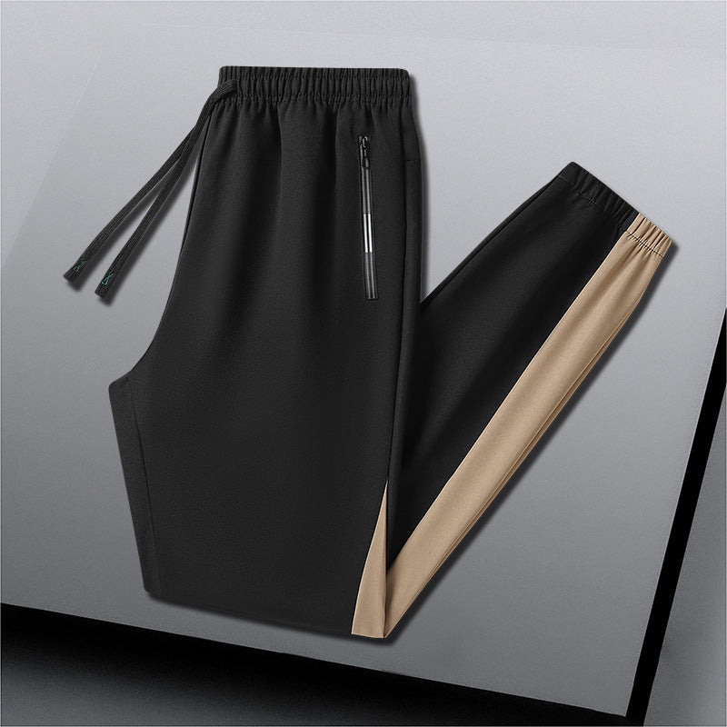 Herren Atmungsaktive Trainingshose mit Elastikbund, Reißverschlusstaschen und seitlichen Kontrastbahnen Echoarchiv