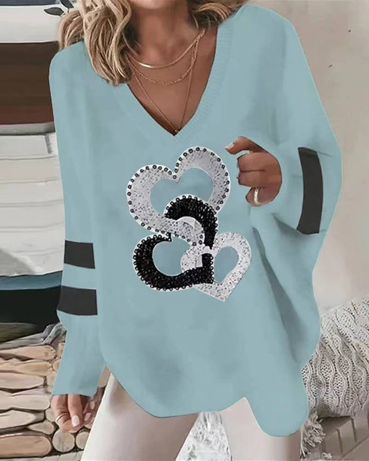 Damen nan übergroßer Strickpullover mit tiefem Ausschnitt Paillettenherz und Kontrastarmstreifen Echo Archiv