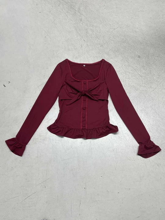 Damen Tailliertes Langarm-Cropped-Top mit Zierschleife, Knopfleiste und Volantbund Echo Archiv