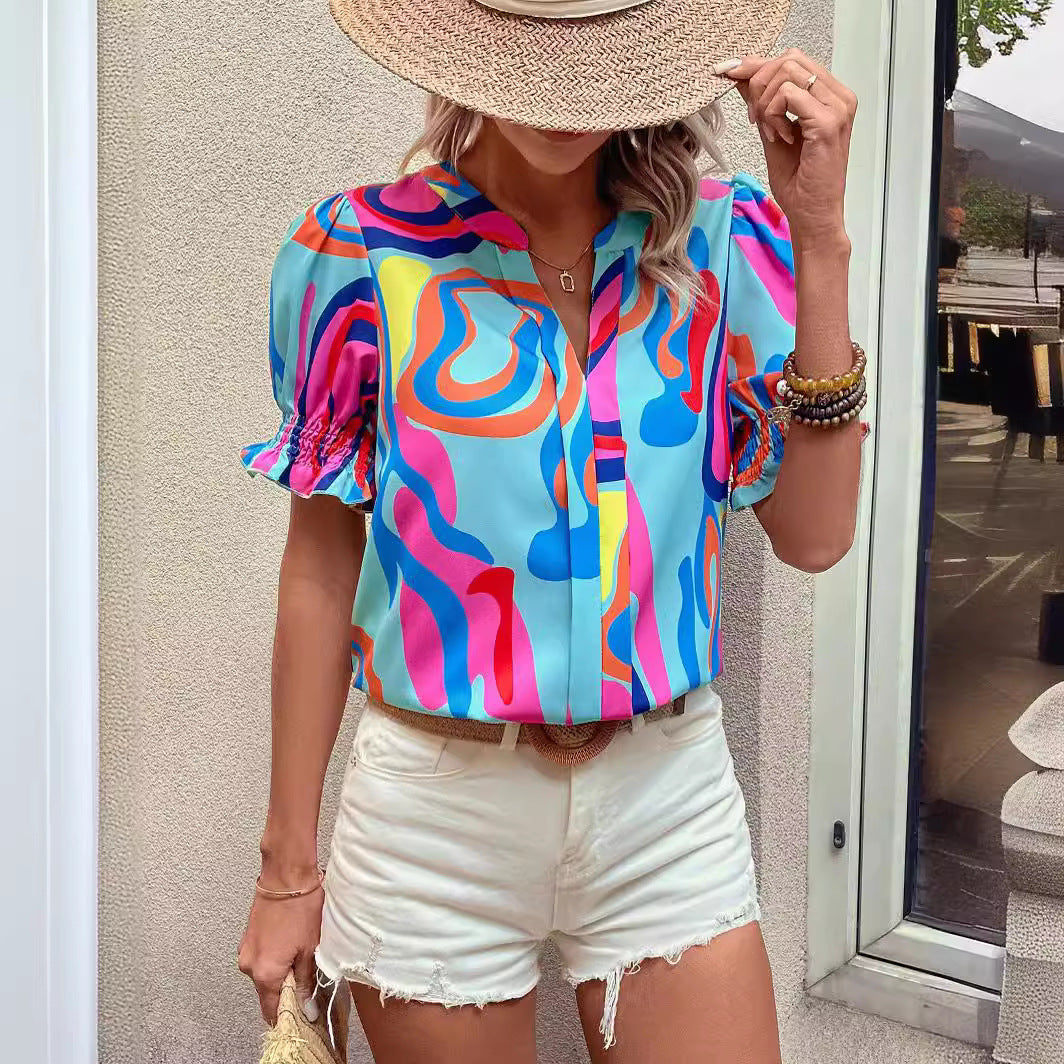 Damen Bluse mit kessen Puffärmeln und kreativem Grafikdesign Echo Archiv