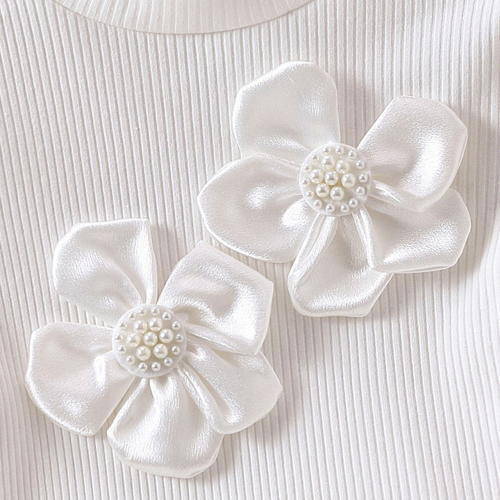 Mädchen modische Bluse mit transparenten Puffärmeln und floralen Akzenten Echo Archiv