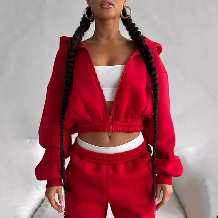 Damen Taillierter Zip-Overall im Loungewear-Stil mit Kapuze, Balloonärmeln und hoher Bundkante – Solévia