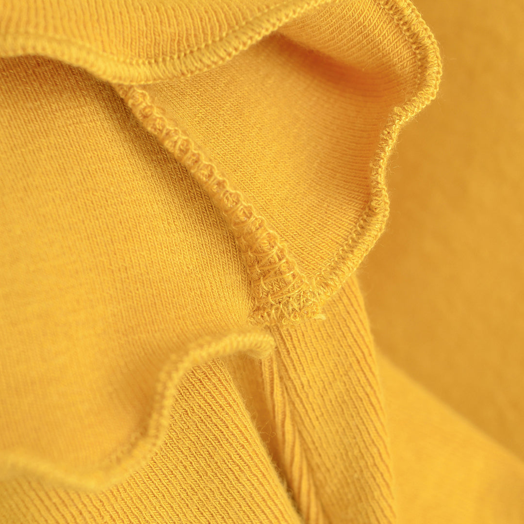 Damen Figurbetontes Langarm-Feinstrickshirt mit quadratischem Ausschnitt und Wellensaum Echoarchiv