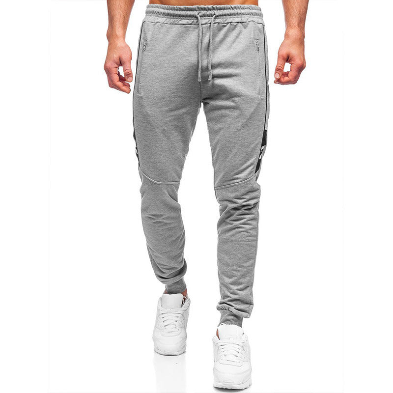 Herren Sportliche Jogginghose mit seitlichen Reißverschlüssen und elastischem Bund Echoarchiv