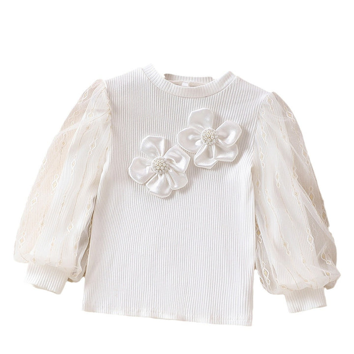 Mädchen modische Bluse mit transparenten Puffärmeln und floralen Akzenten Echo Archiv