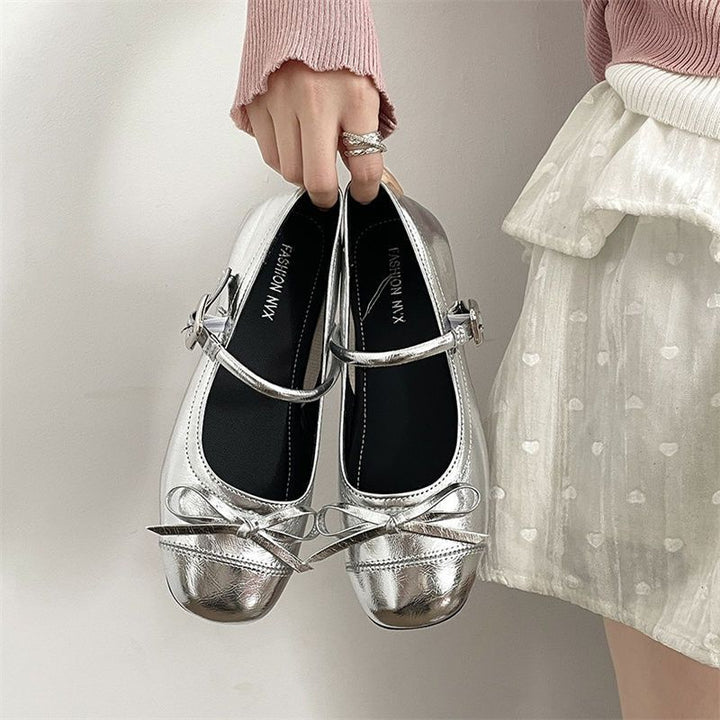 Damen Riemchen‑Ballerinas mit dekorativer Schleife und verstellbarem Schnallenriemen – Avérine