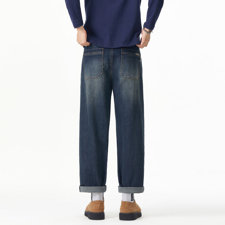 Herren Weite gerade geschnittene Denim-Jeans mit Used‑Wash und Umschlagbund Echoarchiv