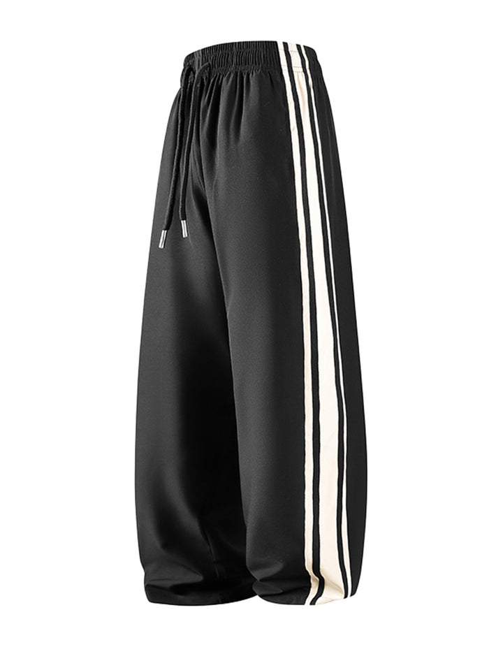 Damen Weite Trackpants mit Tunnelzugbund und seitlichen Kontraststreifen Echo Archiv