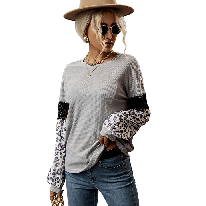 Damen Langarmshirt mit Leopardenärmeln und Spitzenbesatz Echoarchiv