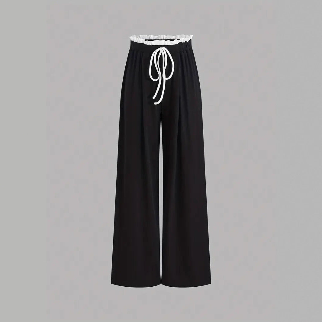 Damen stylishes Sport-Set mit hoch taillierter Weitbein-Hose und sportlichem Bustier Echo Archiv