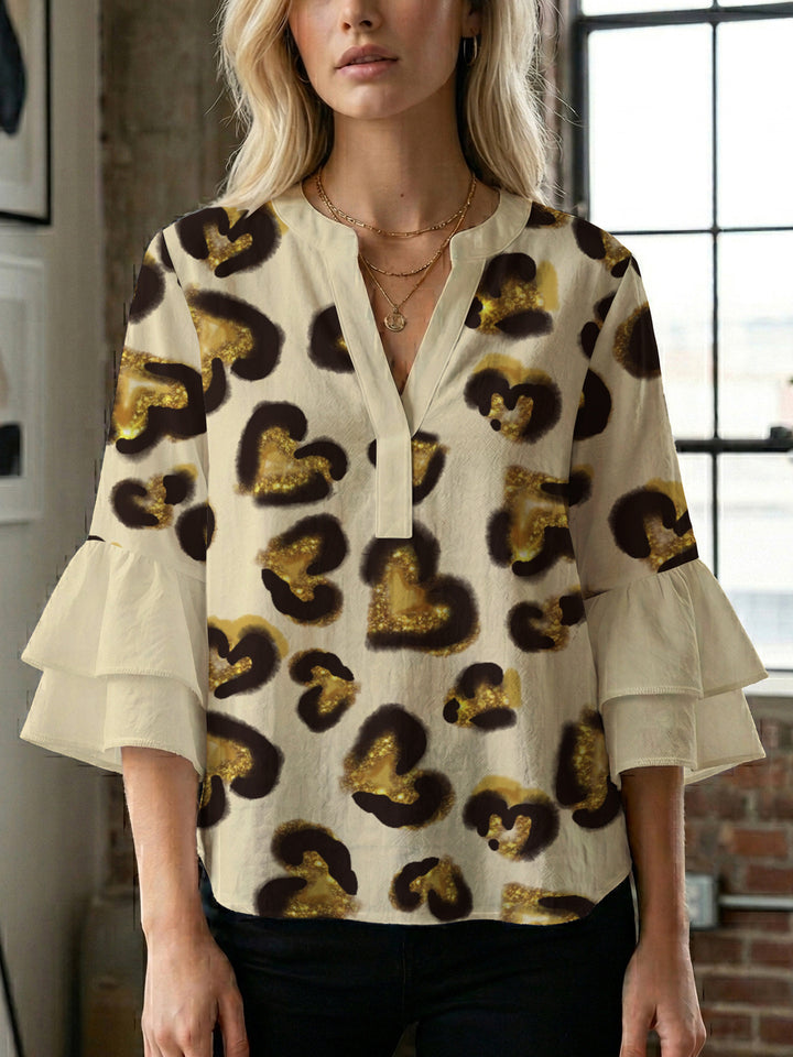Damen Bluse mit voluminösen Rüschenärmeln und modernem Motiv Echo Archiv