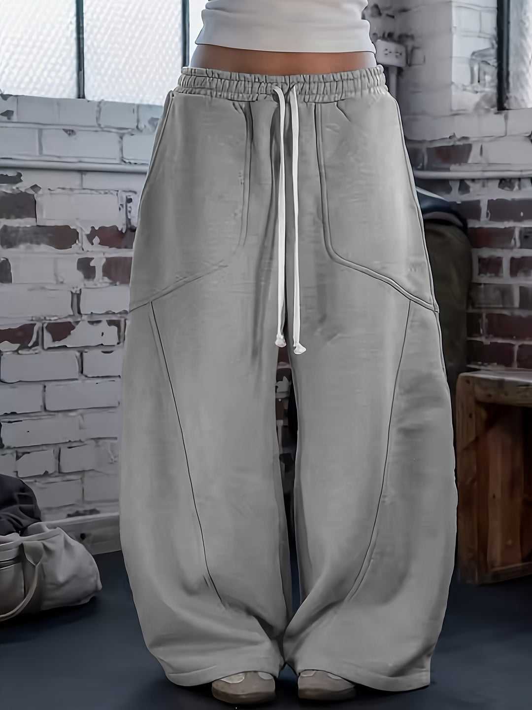 Damen Weite High‑Waist Baggy‑Jogginghose mit Tunnelzug, elastischem Bund und aufgesetzten Taschen Echoarchiv