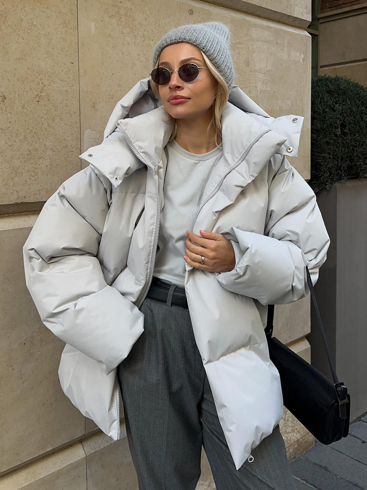 Damen Oversize Steppjacke mit Kapuze und wattierter Thermofüllung Echoarchiv