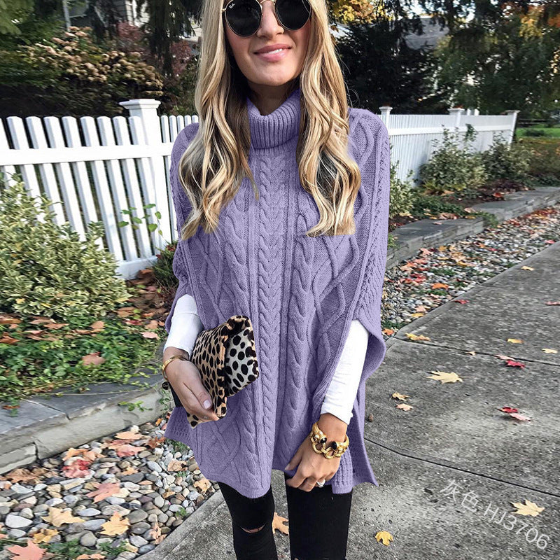 Damen nan kastiger Strickponcho mit hohem Rollkragen, Zopfstruktur und seitlichen Schlitzen Echo Archiv