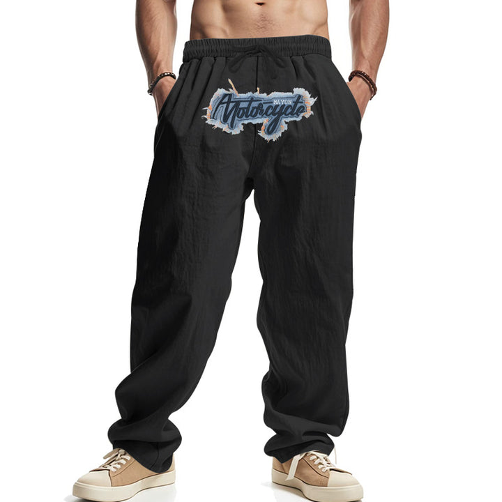 Herren Locker sitzende Leinenoptik-Relaxhose mit elastischem Bund, Kordelzug & Frontprint – Sorevano