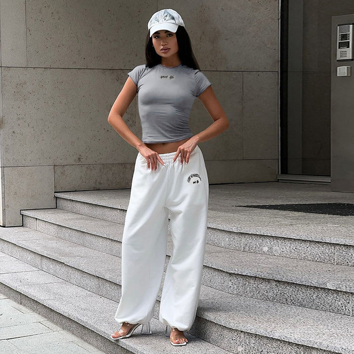 Damen Sportliches Set mit Figurbetontem Oberteil und weitem Hosen Echo Archiv