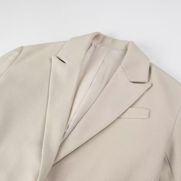 Damen Langmantel mit langem Fransen‑Saum, kastiger Oversize‑Silhouette und Reverskragen Echo Archiv