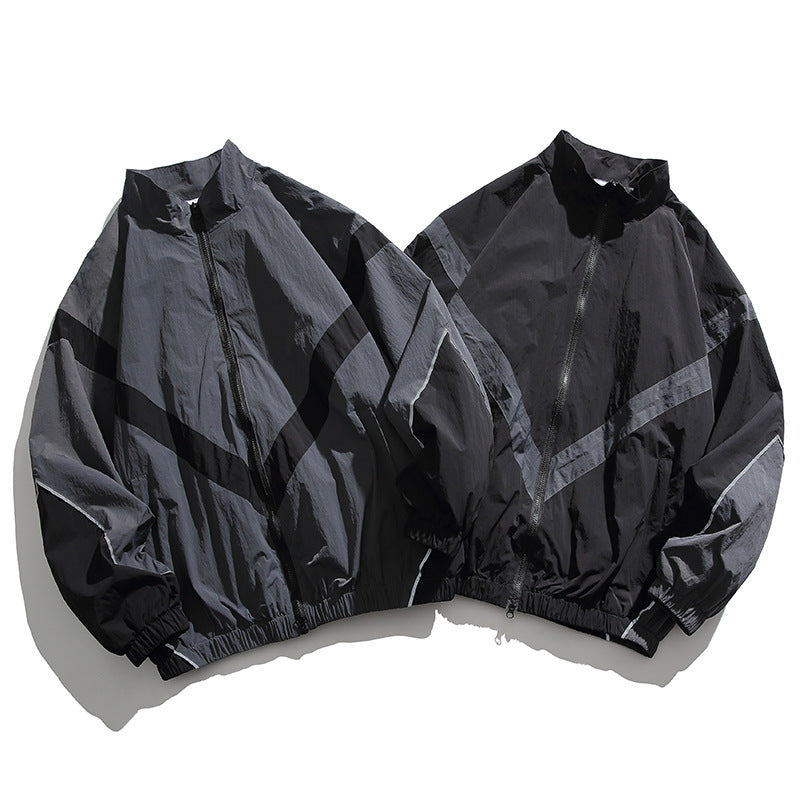 [Unisex] Oversize technische Wind- und Regenjacke mit Stehkragen, reflektierenden Paspeln und elastischem Saum Echo Archiv
