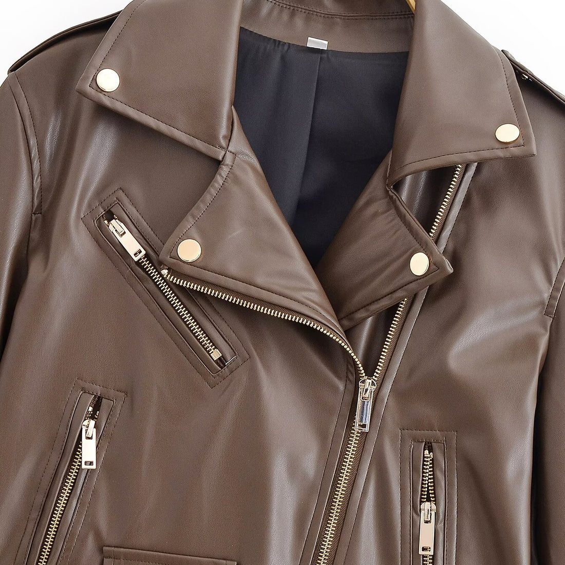 Damen Bikerjacke aus Lederimitat mit asymmetrischem Reißverschluss, Taillengürtel und goldfarbenen Details Echoarchiv