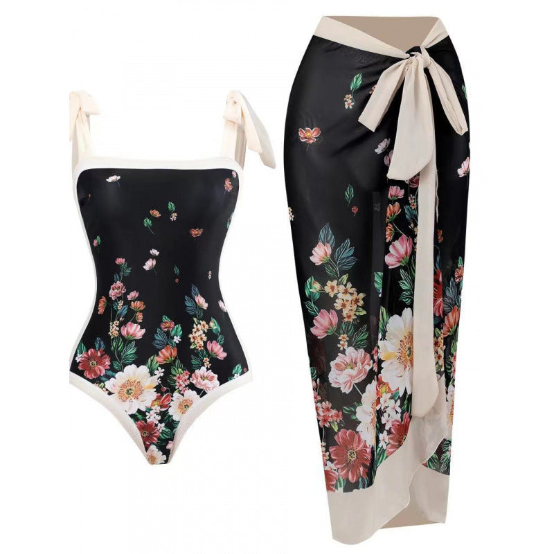 Damen Einteiliger Badeanzug mit stilvollem Wickelrock und modischem Muster Echo Archiv