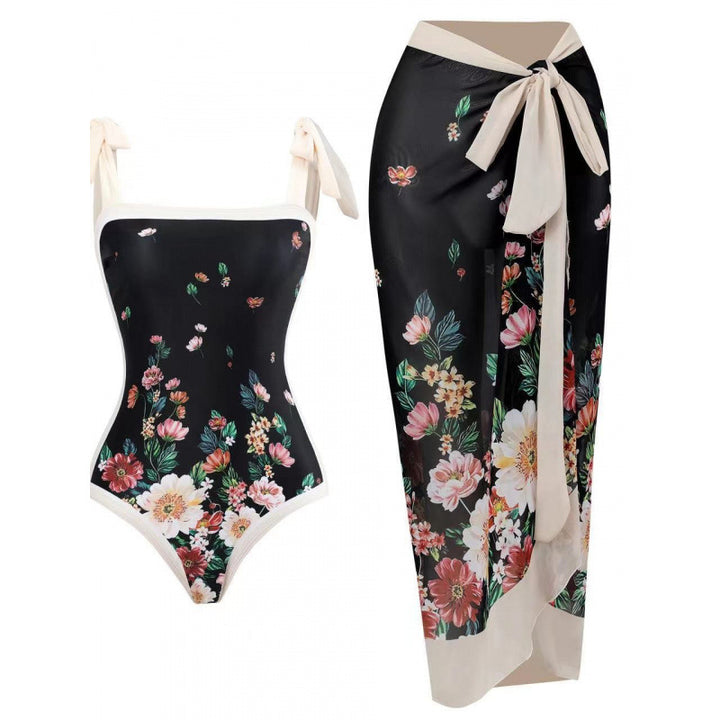 Damen Einteiliger Badeanzug mit stilvollem Wickelrock und modischem Muster Echo Archiv