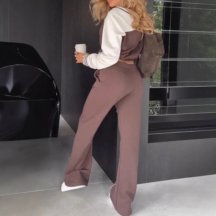 Damen nan sportlich-elegantes Zweiteiler-Set aus Baumwollmix mit V-Ausschnitt Sweatpullover und hochgeschnittener Schlaghose Echo Archiv