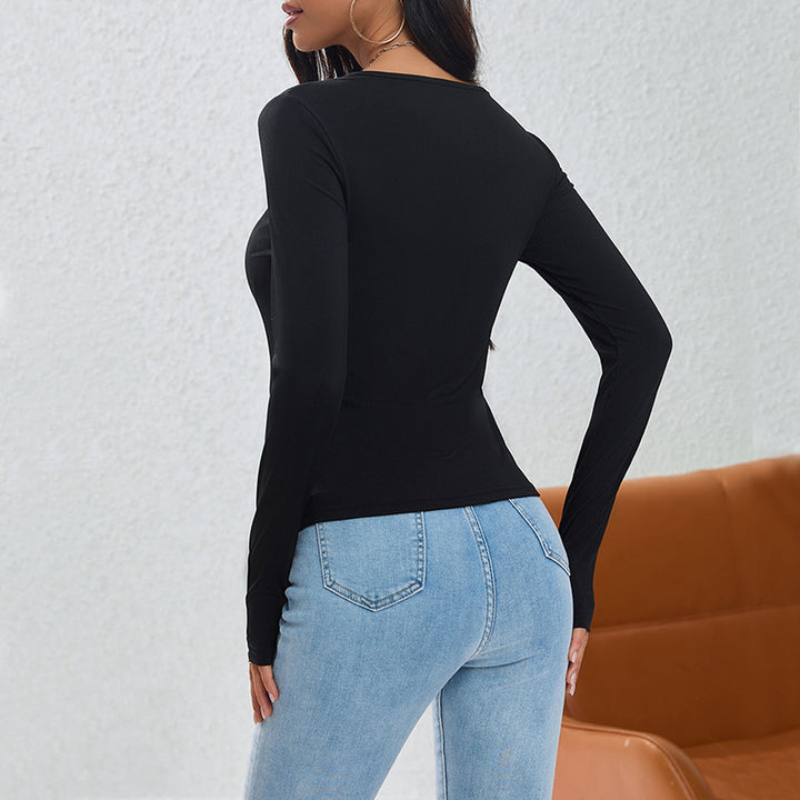 Damen asymmetrisches geripptes Longsleeve mit Diagonalknopfleiste und spitzem Saum – Avérine