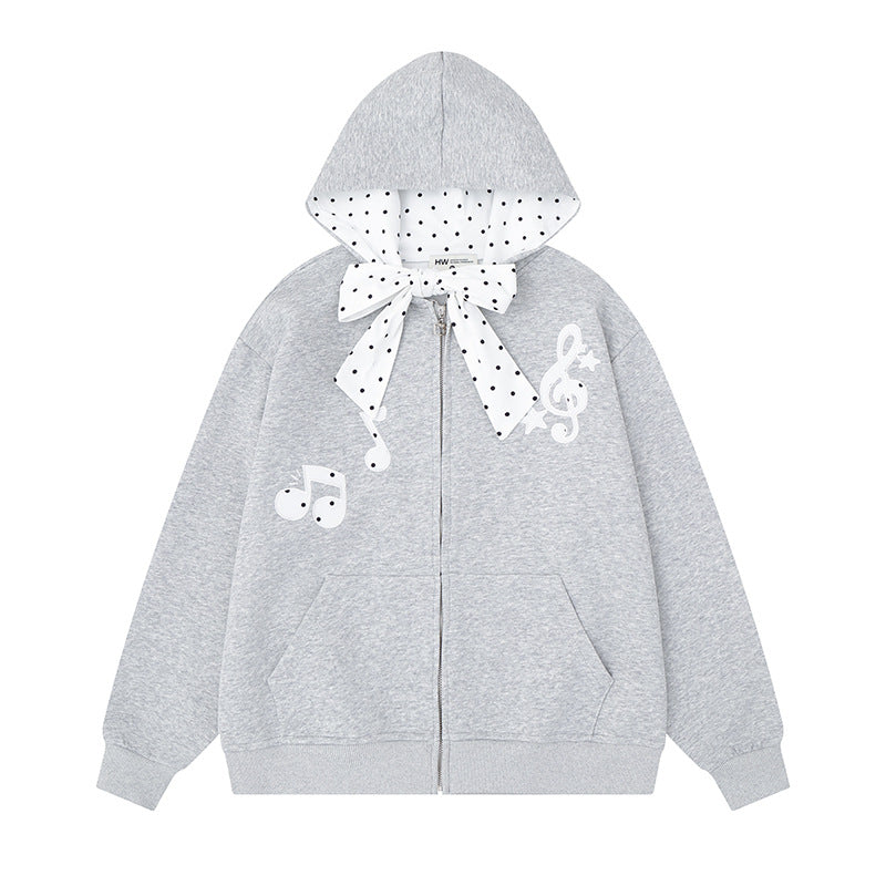 Damen Kapuzensweatjacke mit gepünktetem Kapuzenfutter, dekorativer Schleife und Notenmotiv Echoarchiv