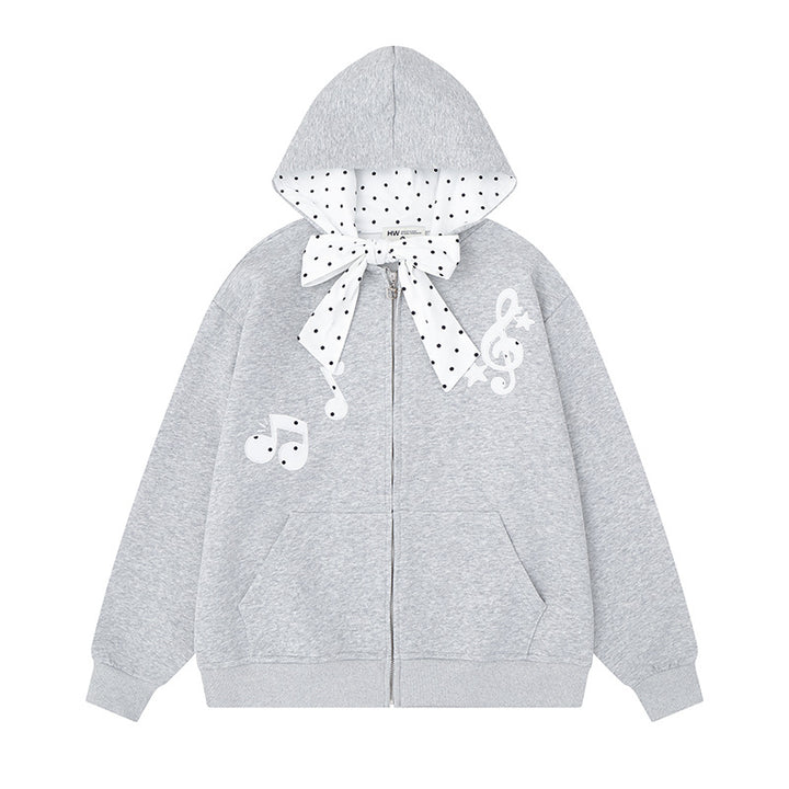 Damen Kapuzensweatjacke mit gepünktetem Kapuzenfutter, dekorativer Schleife und Notenmotiv Echoarchiv