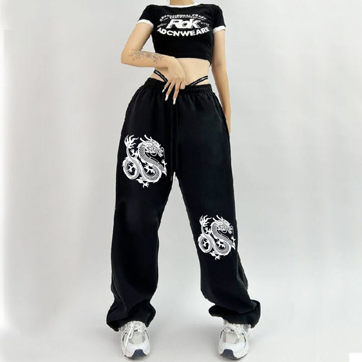 Damen weite Jogginghose hochgeschnitten mit seitlichem Statementprint und elastischem Bund – Avélisse